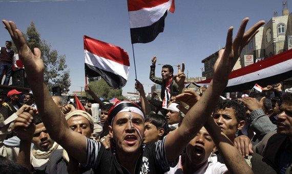 Anti-government protesters shout slogans during a protest demanding the ouster of Yemen's President Ali Abdullah Saleh outside Sanaa